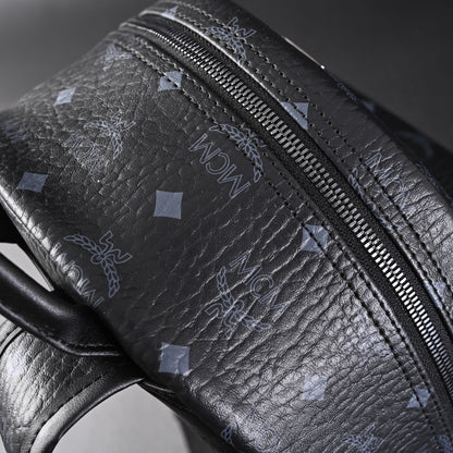 MCM Stark Visetos Medium Backpack – Black Monogram with Studded Detailing